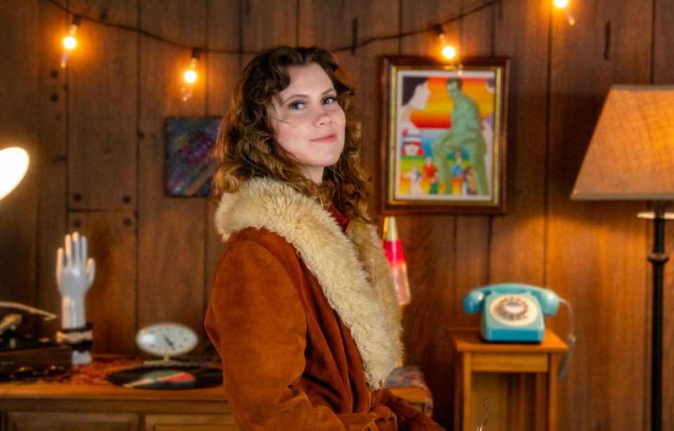 Emily wearing a wrap coat with faux fur sheepskin collar