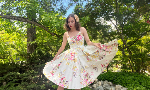 Marley in a 1950’s floral swing dress and white sandals