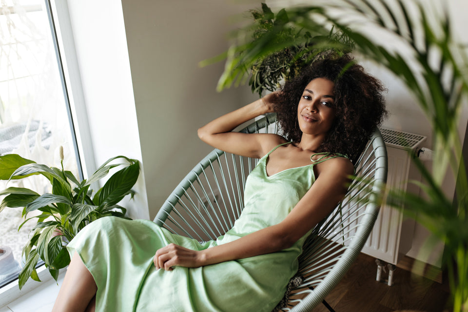 a beautiful woman wearing a green silk dress
