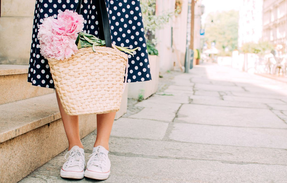 a blue and white spotty skirt teamed with casual white sneakers
