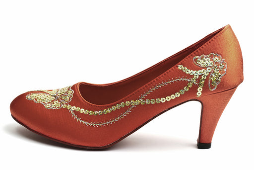 a satin shoe embroidered with a butterfly design in sequins and thread