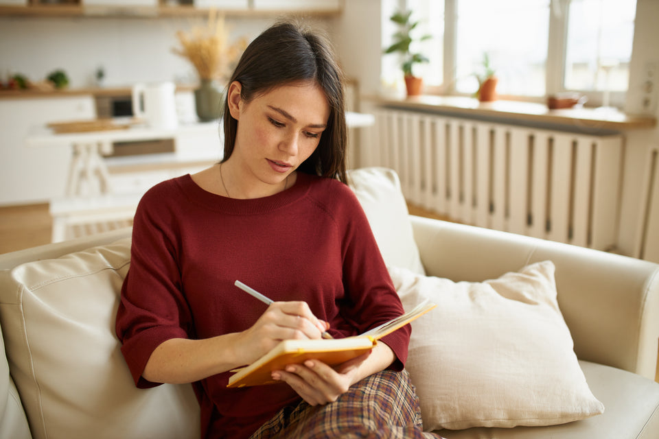 a woman making a note in her schedule