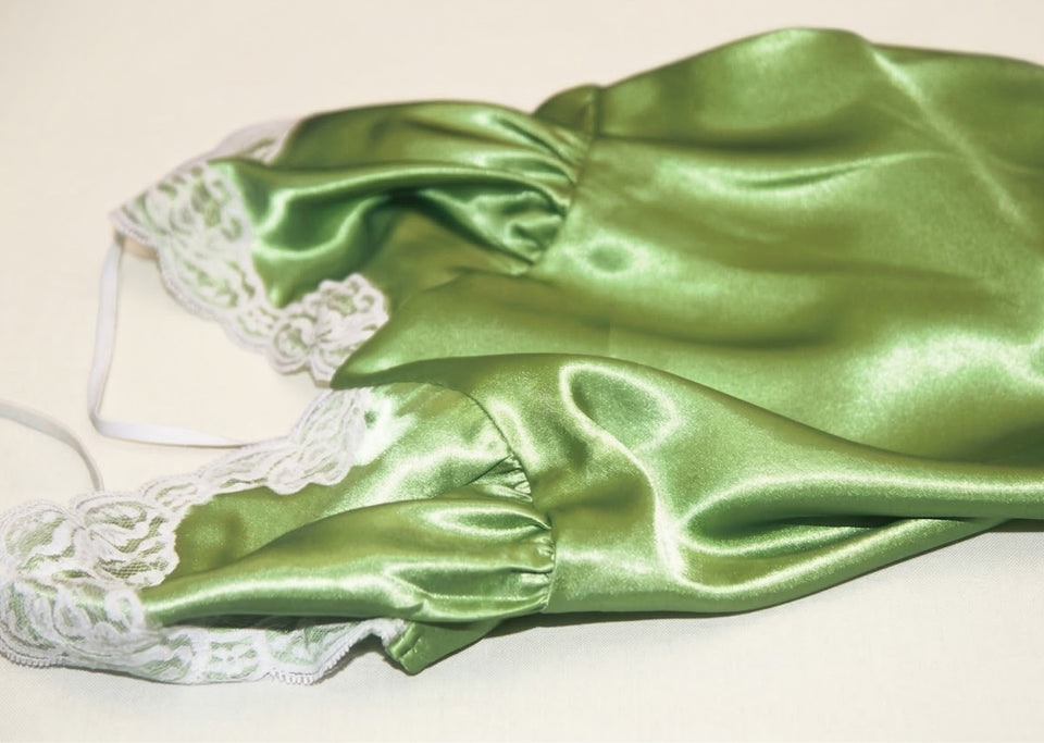 a beautiful green silk camisole with lace edging
