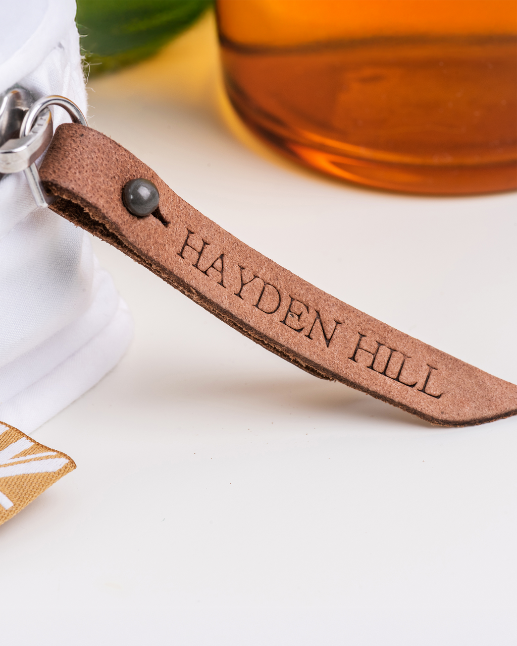 a close up of the Hayden Hill removable leather zipper pull