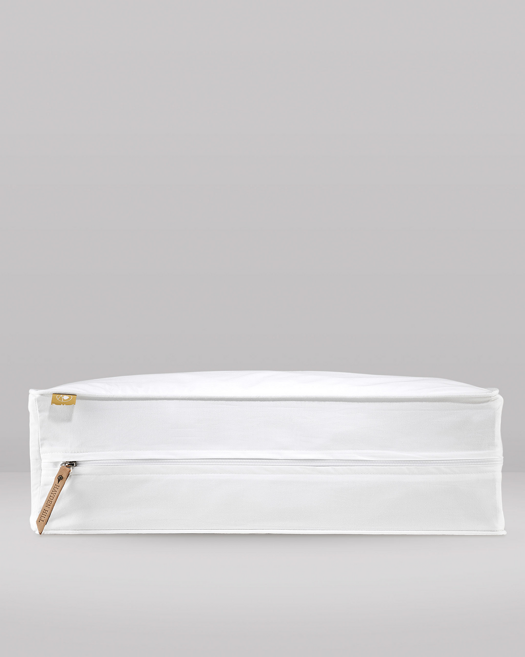 a side profile of an extra large storage bag showing the leather zipper pull and pip