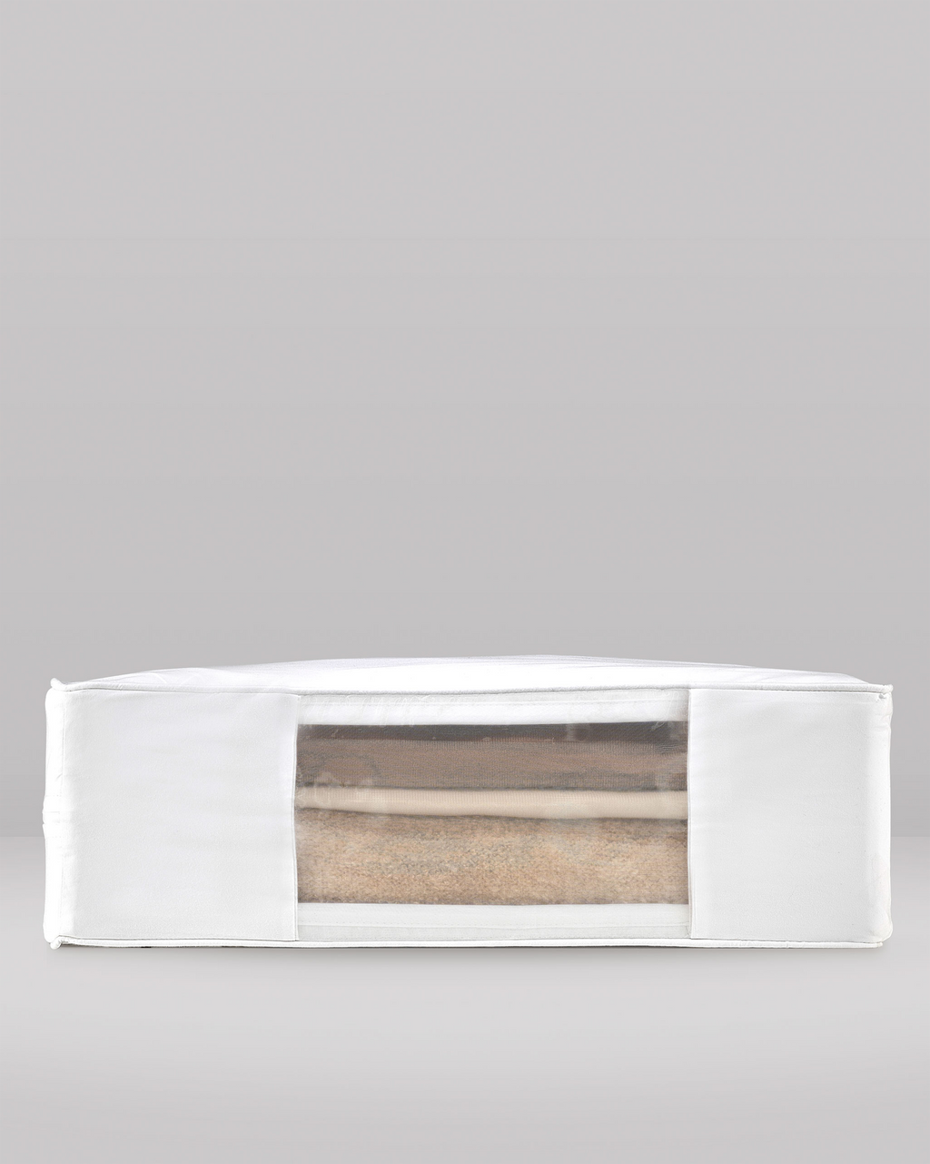 the side profile of an extra large clothes storage bag showing the organza panel and woollens stored inside