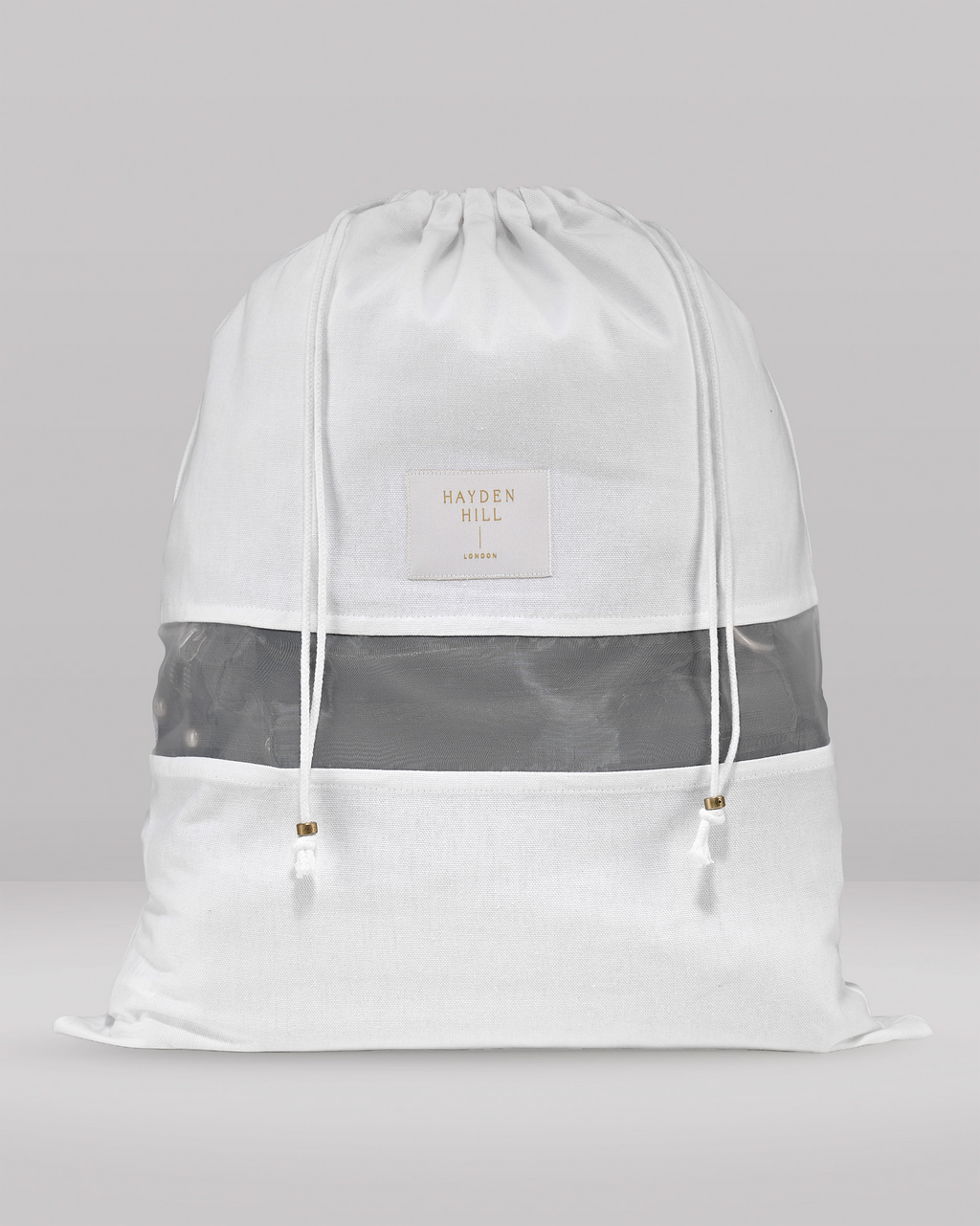 the front view of a medium dust bag showing the organza panel and drawstrings with brass sliders