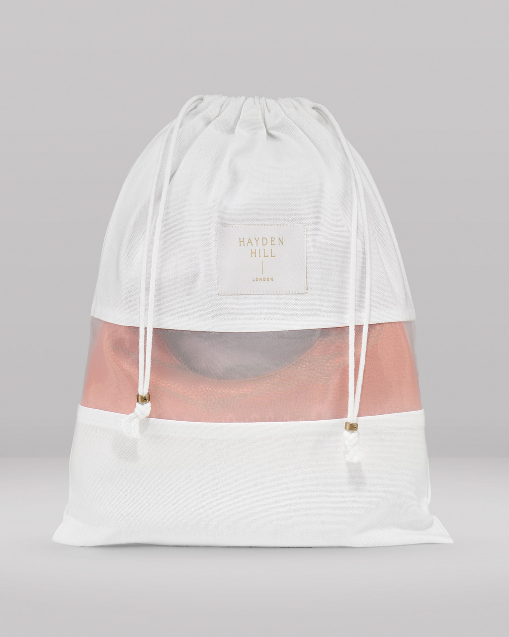the front view of a small dust bag showing the organza panel and drawstrings with brass sliders
