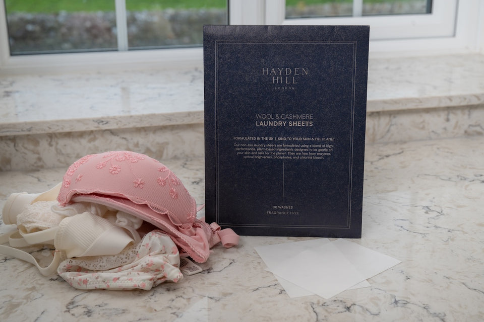 Hayden Hill laundry sheets next to some delicate lingerie