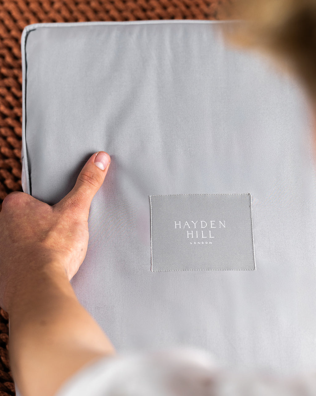 the top view looking down on a grey storage bag with a Hayden Hill label