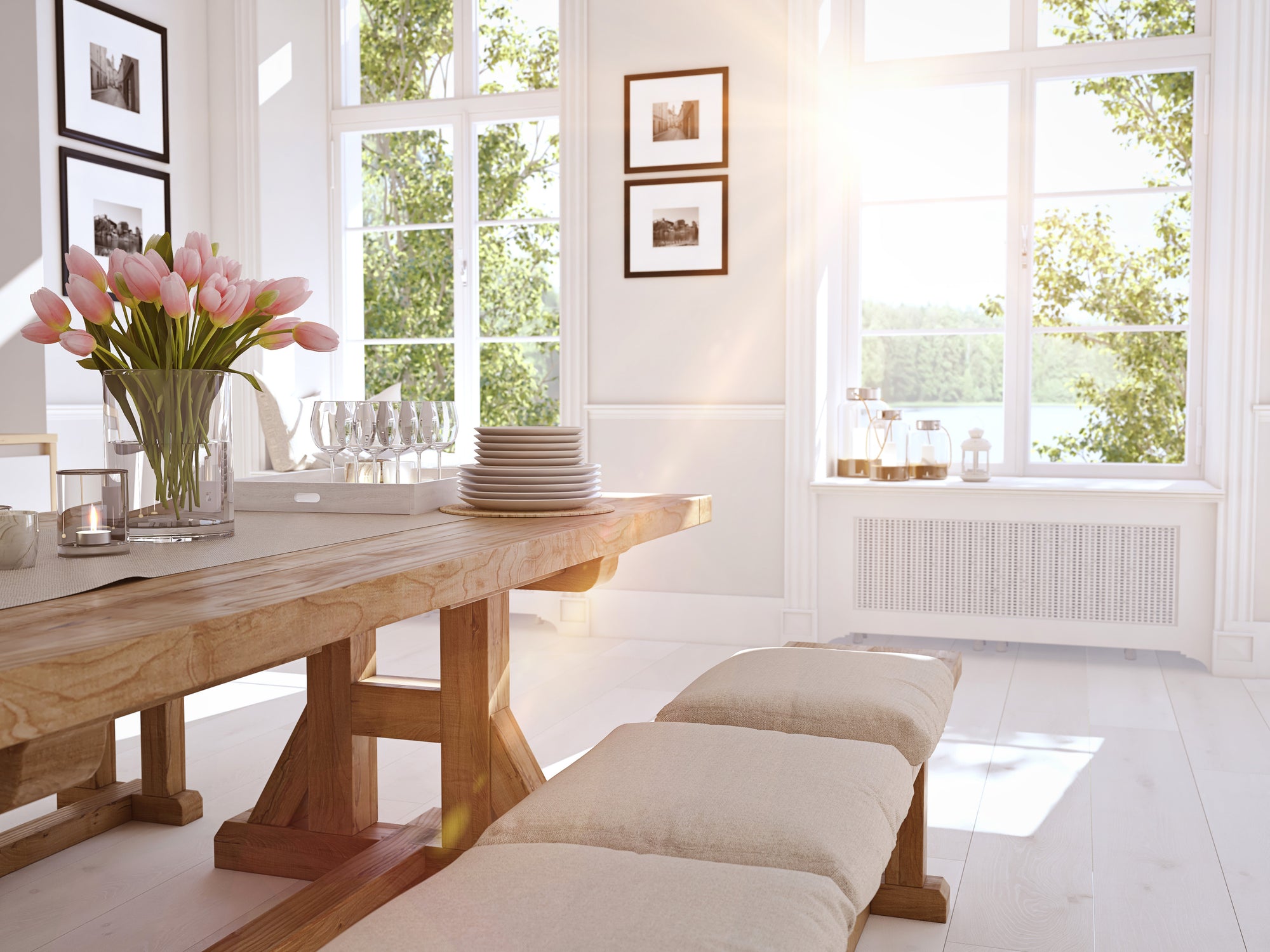 beautiful sunny dining room with tulips in a vase on the table