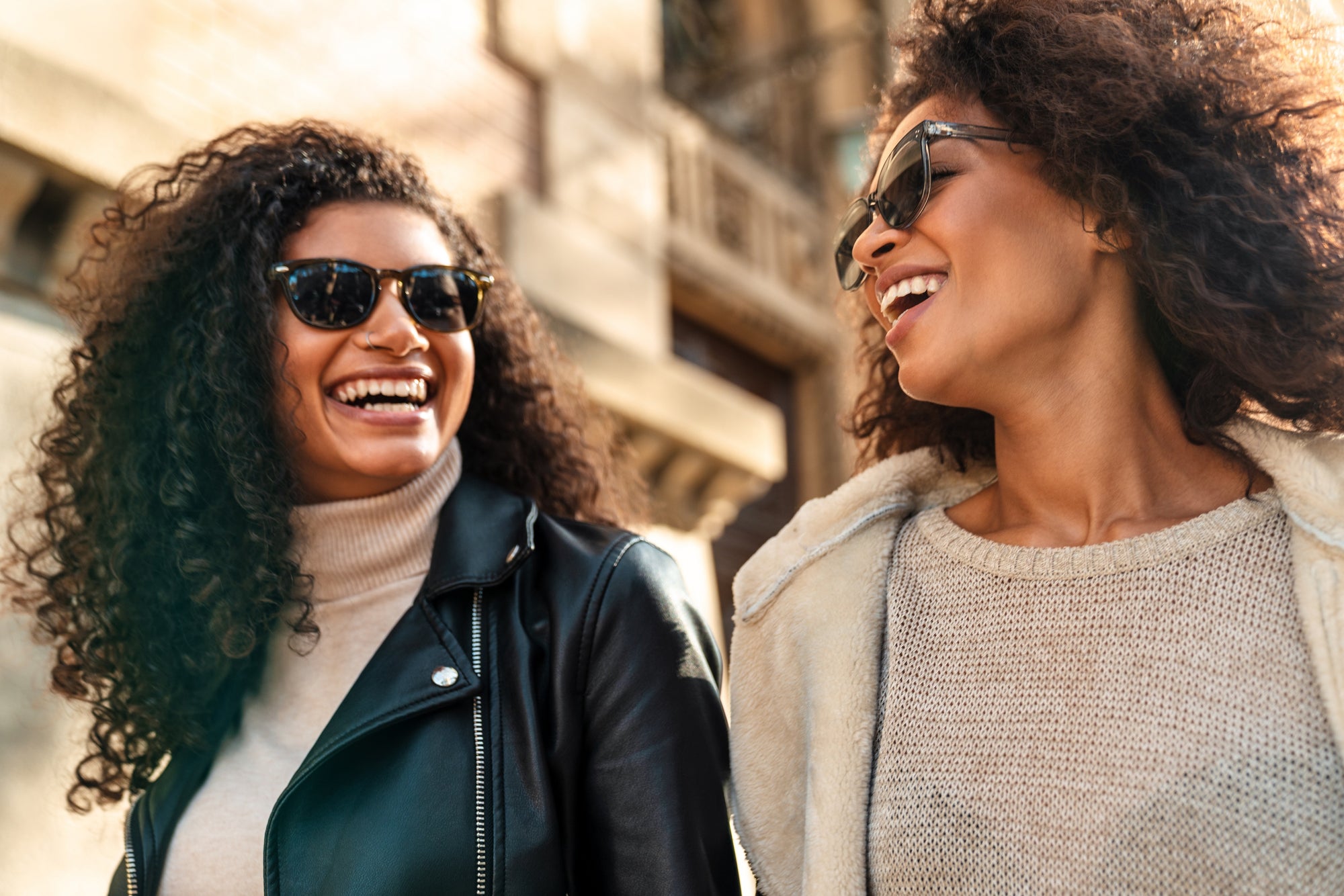 two stylish women taking a walk together