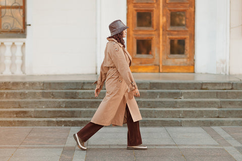 a woman wearing a raincoat and waterproof hat