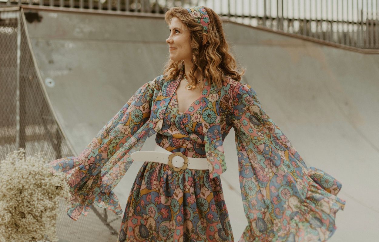 Emily wearing a 70’s style patterned dress by @jesssamperphoto