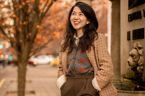 Mai looking chic wearing a vintage style jacket, vest and trousers