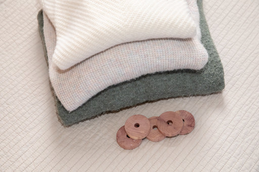 woolen sweaters with a collection of cedarwood blocks that can also be used on hangers