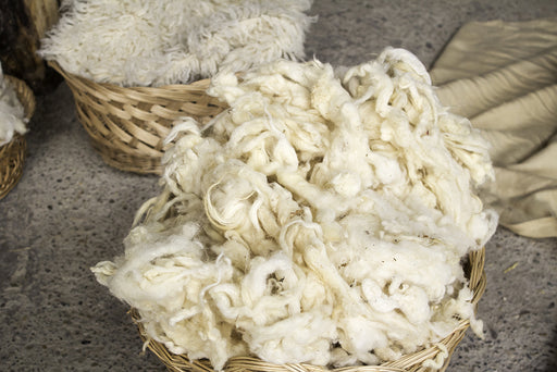 natural wool fibers in woven baskets