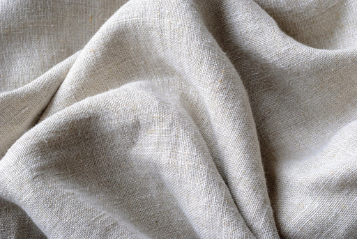 gathered and folded woven linen fabric
