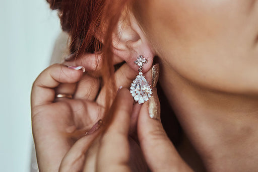 a close up of a stunning diamond drop earring