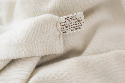 a 100% pure cashmere label on white cashmere fabric