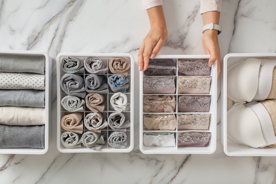 drawer dividers full of neatly rolled underwear and socks