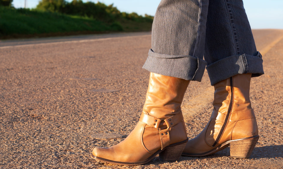 a pair of pale tan leather boots