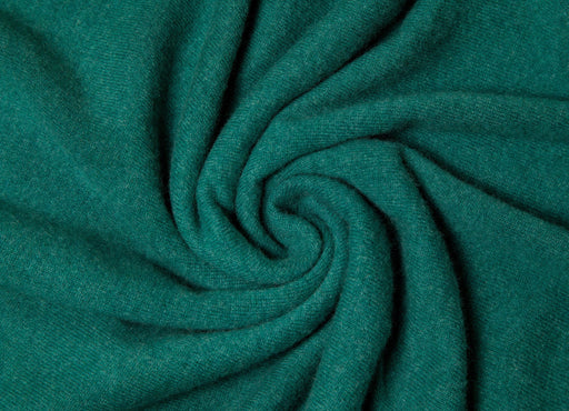 a swathe of dark green cashmere material