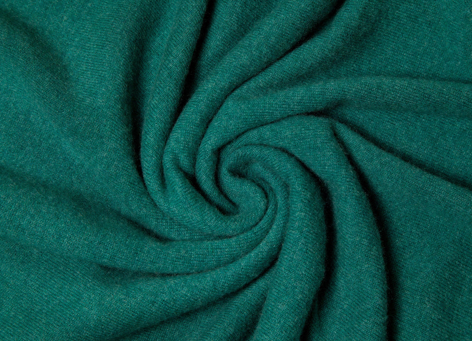 a swathe of dark green cashmere material