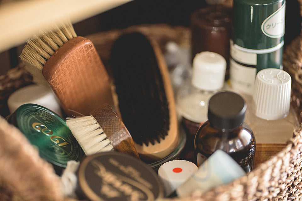 a leather cleaning kit containing brushes and oils