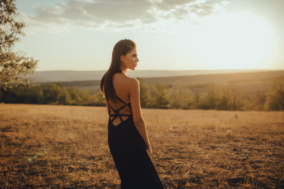 a woman wearing a black dress