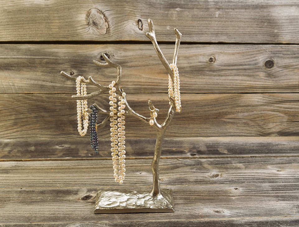 necklaces and earrings on a jewelry tree