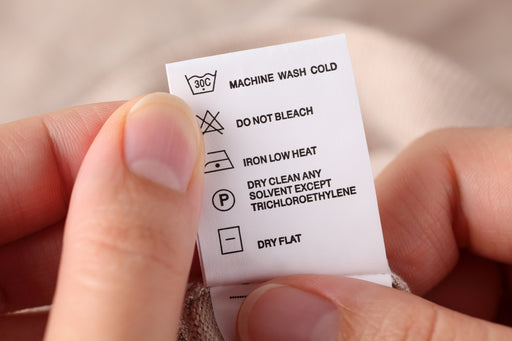 a clothing care label with dry cleaning instructions
