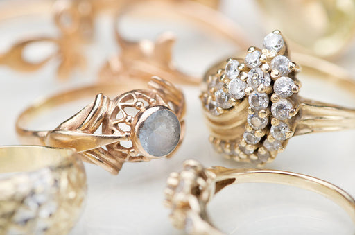 a collection of gold rings with semi precious stones and diamonds