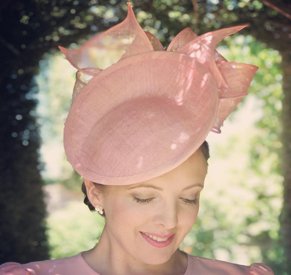 Alicia wearing a beautiful pale pink hat designed by milliner Rachel Trevor Morgan