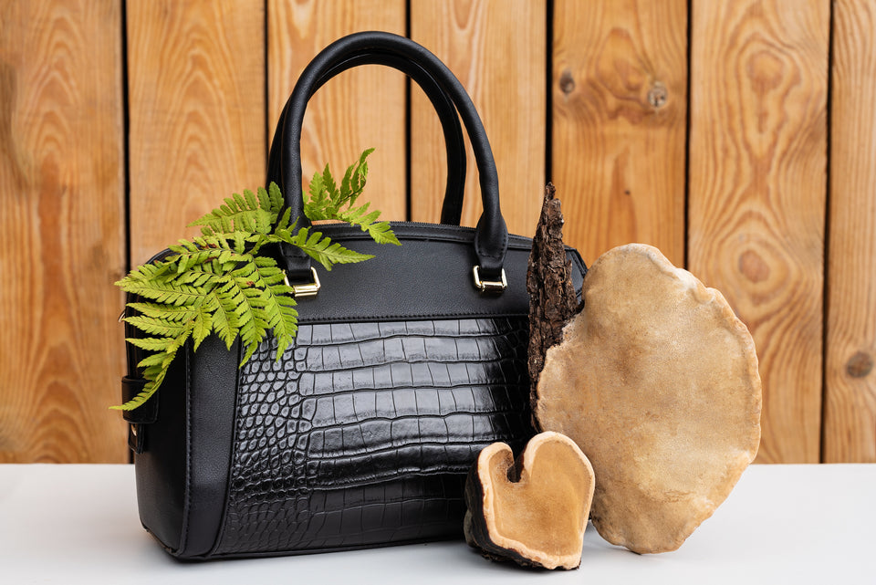 a stylish black purse made from mushroom leather