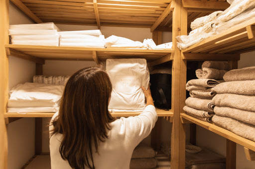a linen closet full of towels and bed linens