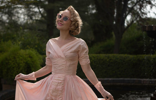 Phoebe in beautiful vintage pale peach colored dress and matching gloves