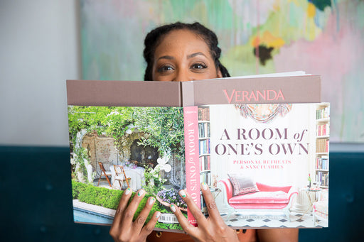 Pia holding a book ‘A Room of One’s Own’ which details beautifully designed restorative spaces