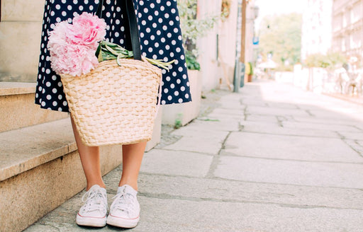 
a blue and white spotty skirt teamed with casual white sneakers
