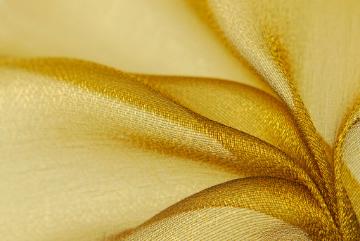 a close up of golden silk organza fabric