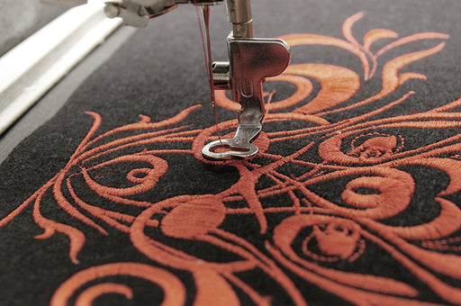 a close up of machine embroidery