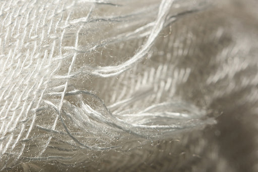 a close up of white viscose threads