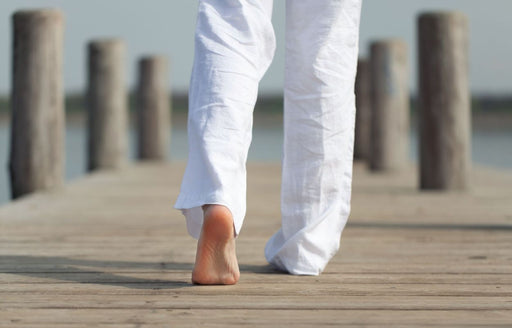 a close up view of white linen trousers