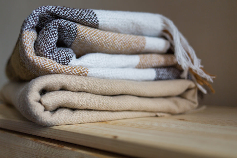 a couple of woolen folded blankets