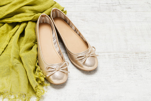 a pair of gold metallic ballet flats, which will keep feet cool in hot weather