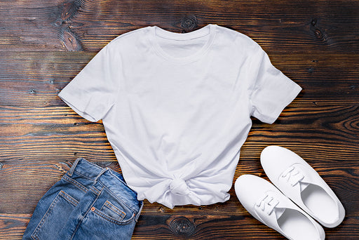  a plain white tee with denim pants and sneakers