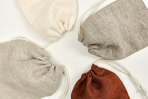 a selection of linen drawstring dust bags
