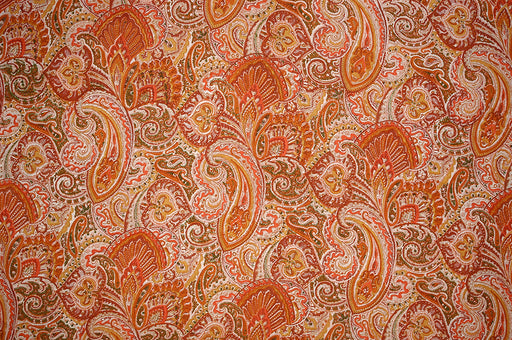a stunning paisley print in orange and taupe colors