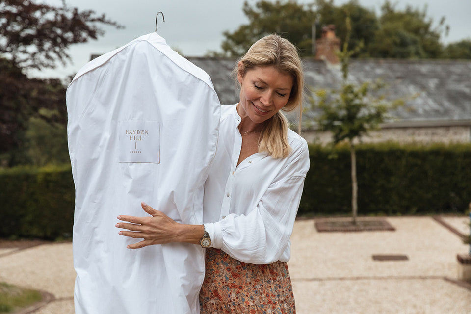 a woman carrying a 100% organic cotton Hayden Hill hanging bag