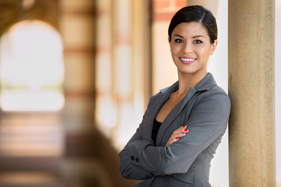 a woman dressed in a dark gray blazer